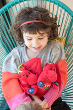 Child cuddling Welsh dragon toy